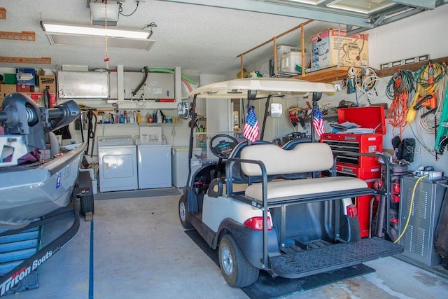garage featuring washing machine and dryer and a garage door opener