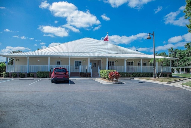 view of property with uncovered parking