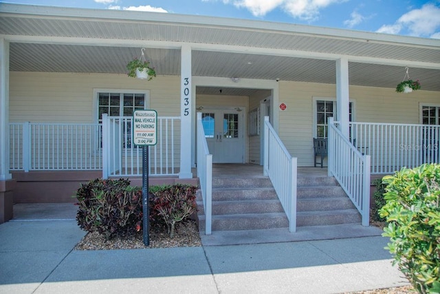 doorway to property with a porch