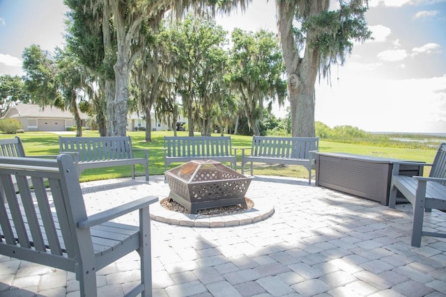 view of patio / terrace featuring an outdoor fire pit