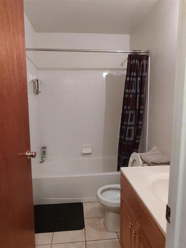 1402 Thousand Roses Dr W Unit 1402, Lake Wales, FL 33853 - bathroom with tile patterned floors, shower / bathtub combination with curtain, vanity, and toilet