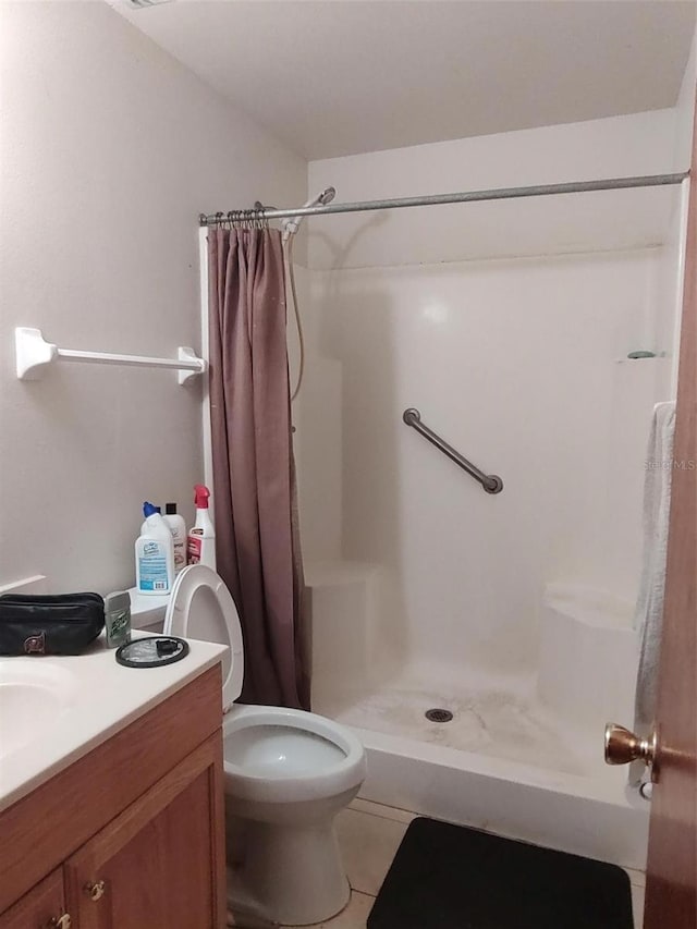 1402 Thousand Roses Dr W Unit 1402, Lake Wales, FL 33853 - full bathroom with a stall shower, vanity, toilet, and tile patterned floors