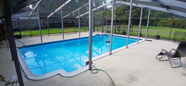 outdoor pool featuring fence, a patio area, and glass enclosure