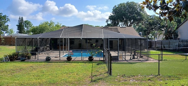exterior space featuring a lanai, a lawn, a fenced backyard, and a patio