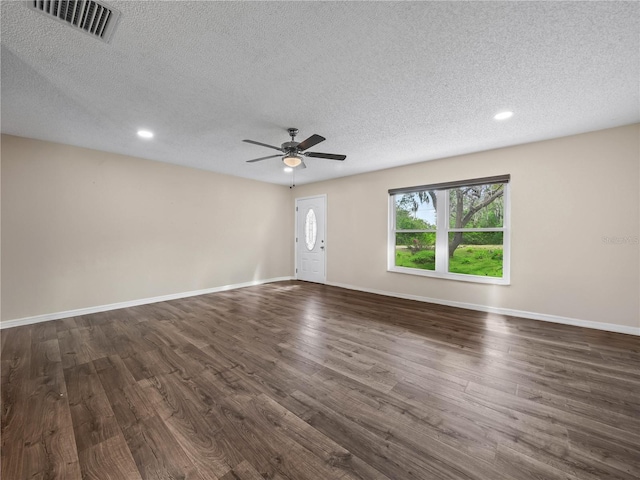 unfurnished room featuring ceiling fan, a textured ceiling, recessed lighting, dark wood-type flooring, and visible vents