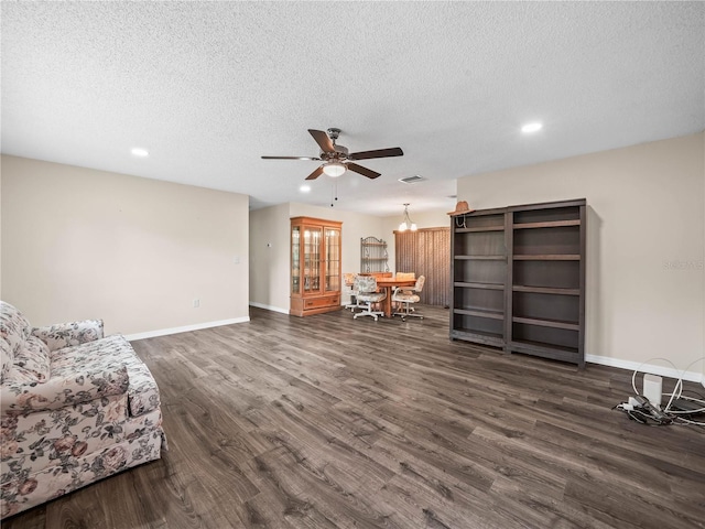 sitting room with recessed lighting, a textured ceiling, ceiling fan, and dark wood-style floors