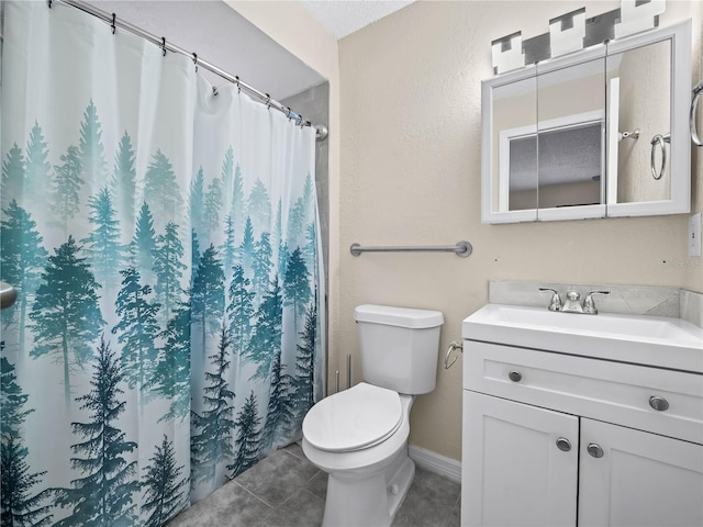 bathroom featuring tile patterned flooring, vanity, toilet, a shower with shower curtain, and baseboards