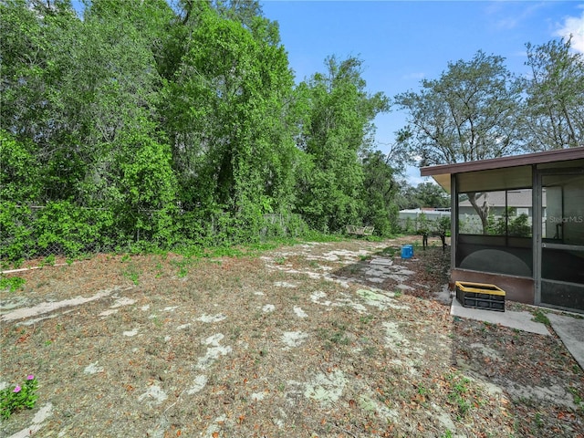 view of yard with a sunroom