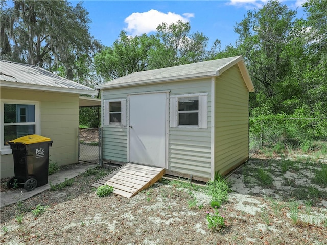 view of shed with fence