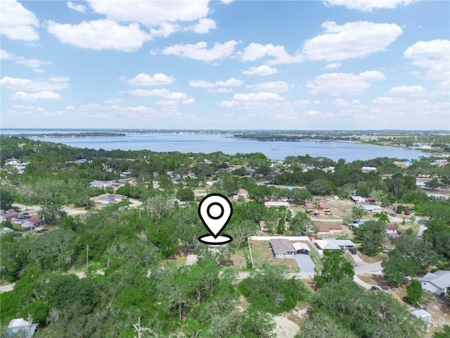 birds eye view of property featuring a water view and a residential view