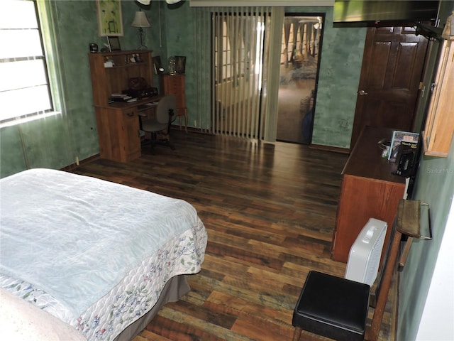 bedroom with hardwood / wood-style flooring