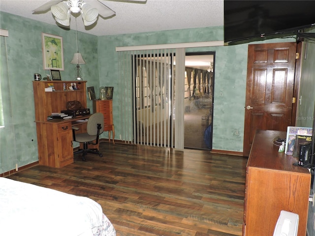 bedroom featuring baseboards, a ceiling fan, and wood finished floors