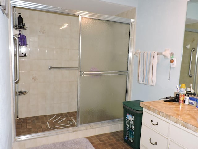 bathroom featuring vanity and a stall shower