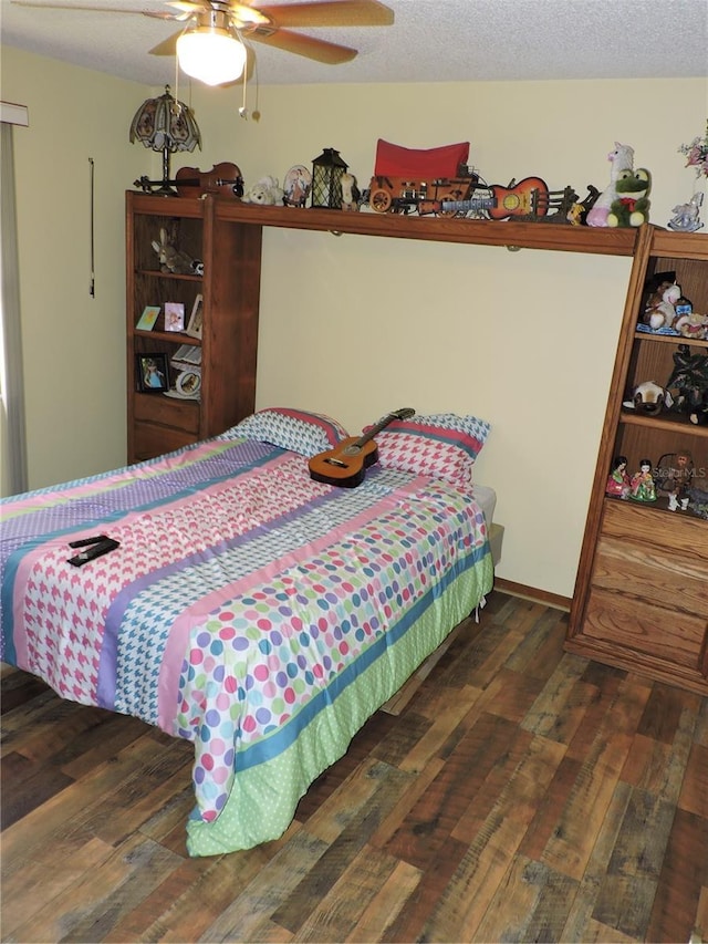 bedroom with wood-type flooring and ceiling fan