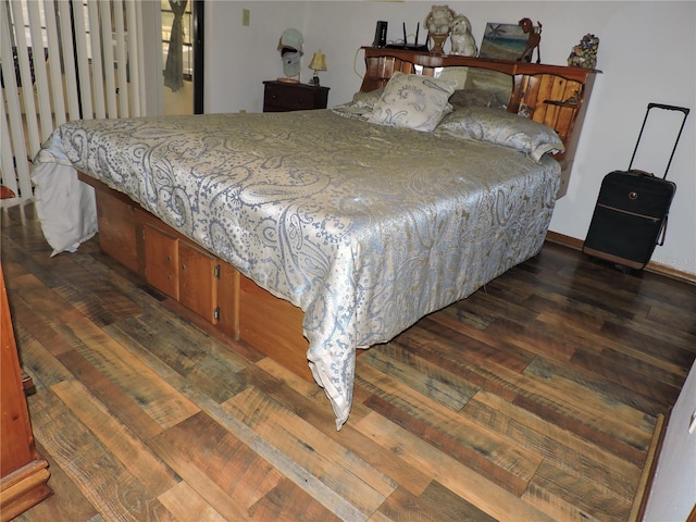 bedroom featuring dark wood-style floors