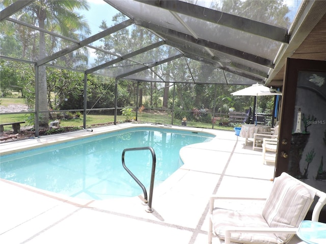 pool with a patio and a lanai