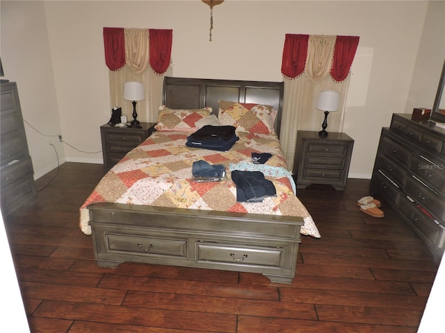 9365 Lemon Dr, Lake Wales, FL 33898 - bedroom with dark wood finished floors and baseboards