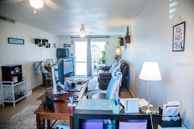 3041 Club Cir, Lake Wales, FL 33898 - tiled living area with ceiling fan, a textured ceiling, and a desk