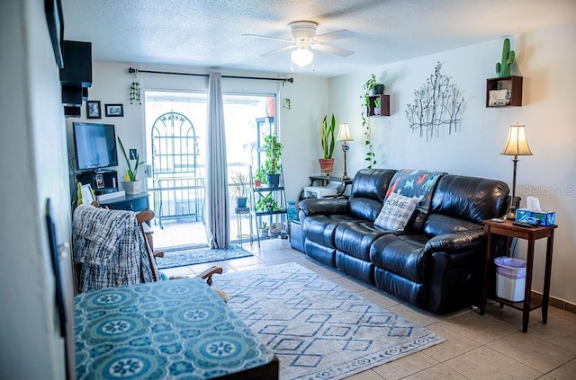 3041 Club Cir, Lake Wales, FL 33898 - living room with ceiling fan, tile patterned flooring, and a textured ceiling