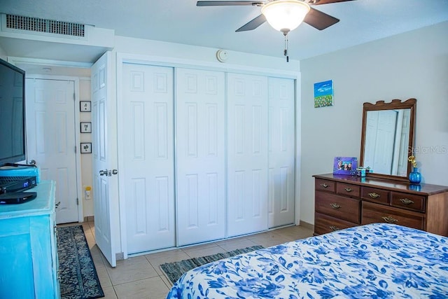 3041 Club Cir, Lake Wales, FL 33898 - bedroom featuring light tile patterned floors, a closet, and ceiling fan