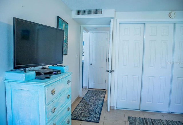 3041 Club Cir, Lake Wales, FL 33898 - bedroom featuring light tile patterned flooring and a closet