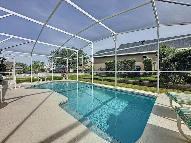2200 Mallory Cir, Haines City, FL 33844 - swimming pool with a patio area and glass enclosure