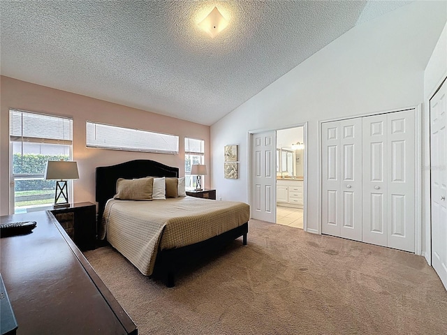 2200 Mallory Cir, Haines City, FL 33844 - bedroom with a textured ceiling, light colored carpet, connected bathroom, and high vaulted ceiling