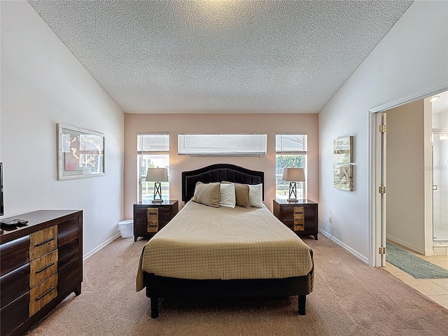 2200 Mallory Cir, Haines City, FL 33844 - bedroom featuring light colored carpet, a textured ceiling, and baseboards