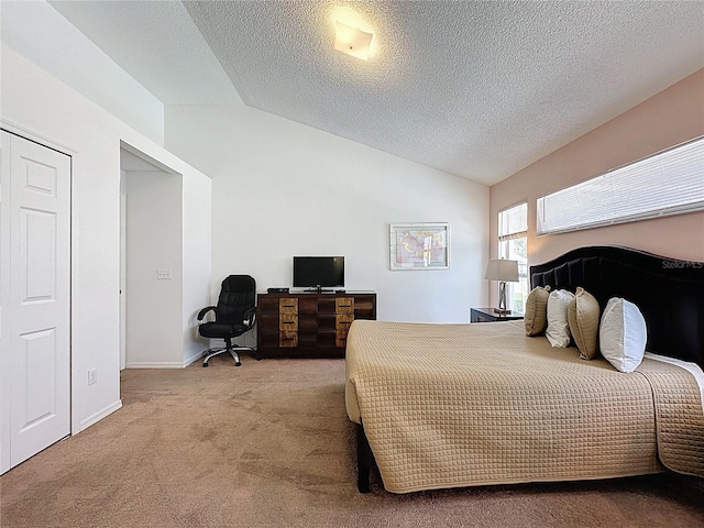2200 Mallory Cir, Haines City, FL 33844 - bedroom with lofted ceiling, carpet floors, a textured ceiling, and baseboards