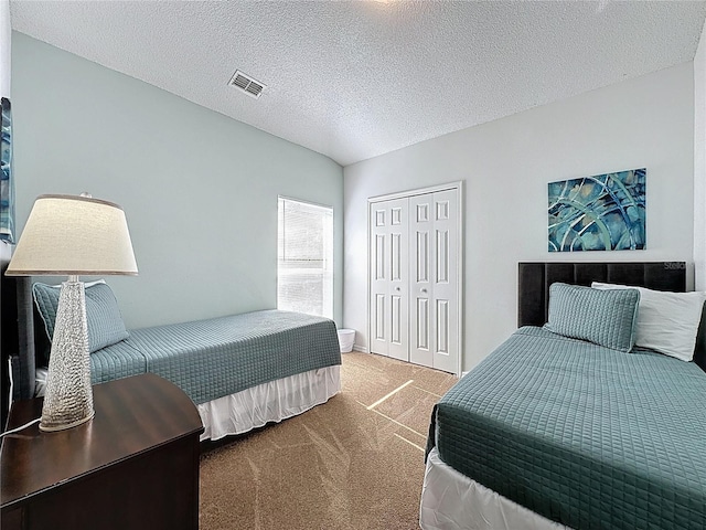 2200 Mallory Cir, Haines City, FL 33844 - carpeted bedroom featuring a closet and a textured ceiling