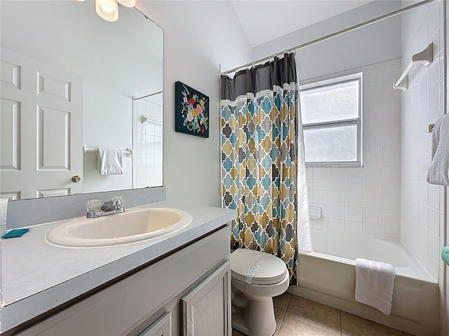 2200 Mallory Cir, Haines City, FL 33844 - bathroom featuring tile patterned floors, toilet, vanity, shower / bath combo, and lofted ceiling