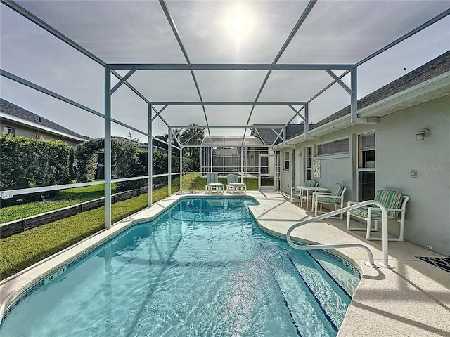 2200 Mallory Cir, Haines City, FL 33844 - swimming pool featuring a patio and glass enclosure