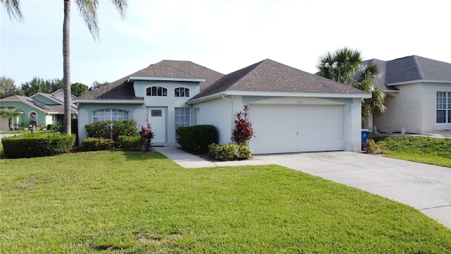 2200 Mallory Cir, Haines City, FL 33844 - view of front of property featuring stucco siding, a garage, concrete driveway, a front lawn, and roof with shingles
