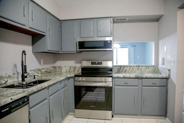 130 E Johnson Ave Unit 206, Lake Wales, FL 33853 - kitchen featuring stainless steel appliances, gray cabinets, and a sink