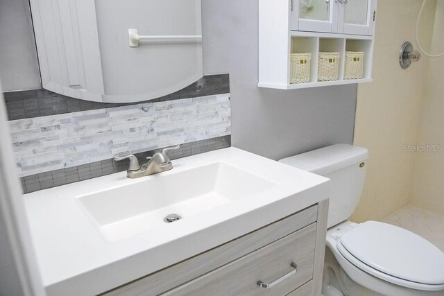 130 E Johnson Ave Unit 206, Lake Wales, FL 33853 - full bathroom featuring decorative backsplash, vanity, toilet, and a tile shower