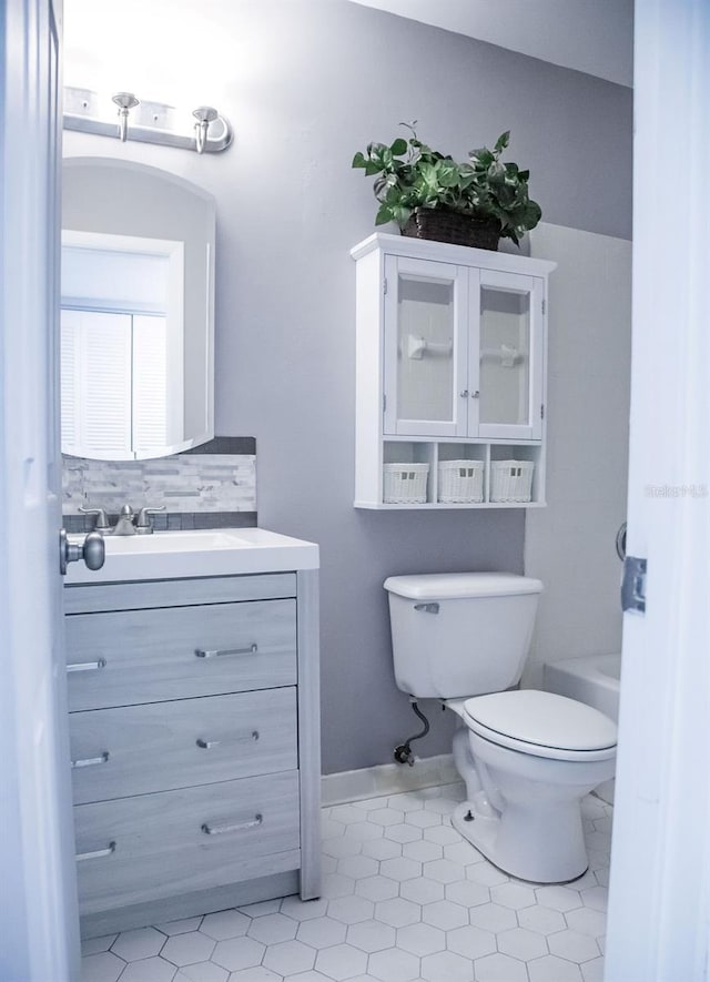 130 E Johnson Ave Unit 206, Lake Wales, FL 33853 - full bath with toilet, vanity, tile patterned floors, and tasteful backsplash