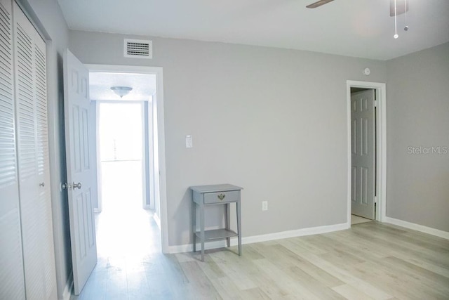 130 E Johnson Ave Unit 206, Lake Wales, FL 33853 - empty room with light wood-style floors, ceiling fan, and baseboards