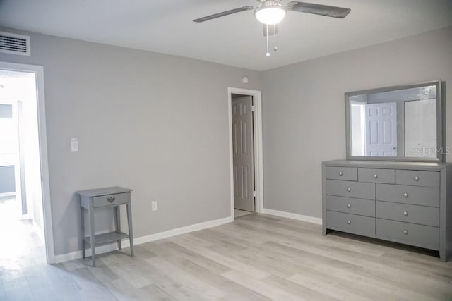 130 E Johnson Ave Unit 206, Lake Wales, FL 33853 - unfurnished bedroom featuring light wood-style flooring, baseboards, and ceiling fan