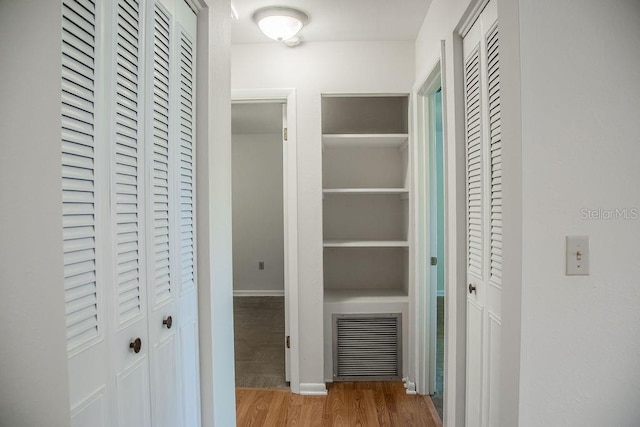 4725 Kayworth Rd, Lake Wales, FL 33898 - corridor featuring wood finished floors and baseboards