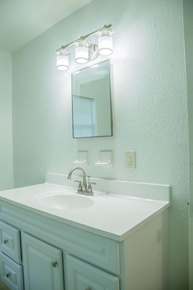 4725 Kayworth Rd, Lake Wales, FL 33898 - bathroom featuring vanity and a textured wall