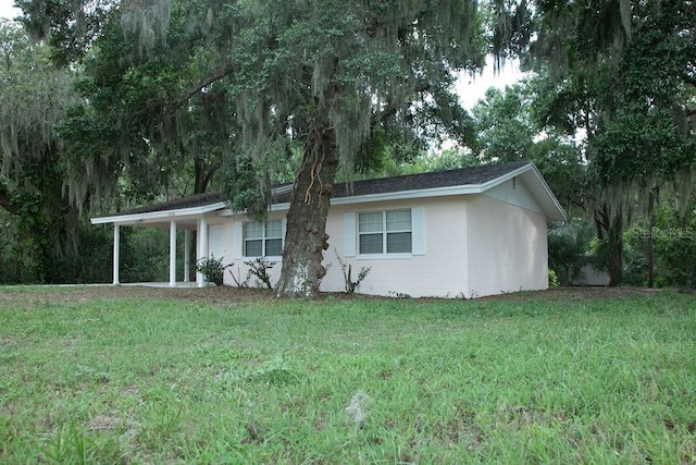 4725 Kayworth Rd, Lake Wales, FL 33898 - view of front of home featuring a front lawn and a carport