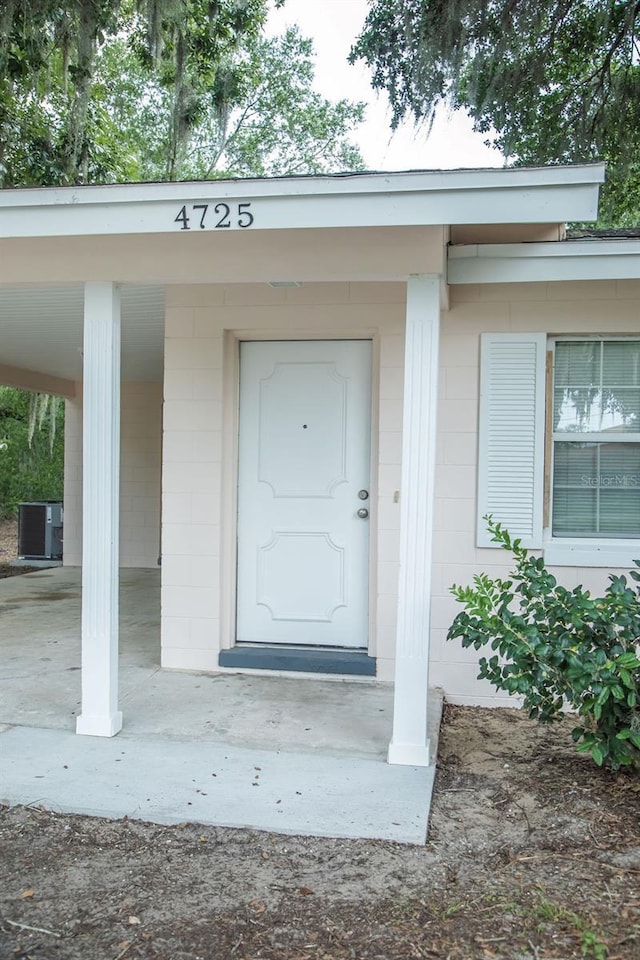 4725 Kayworth Rd, Lake Wales, FL 33898 - entrance to property featuring concrete block siding and cooling unit