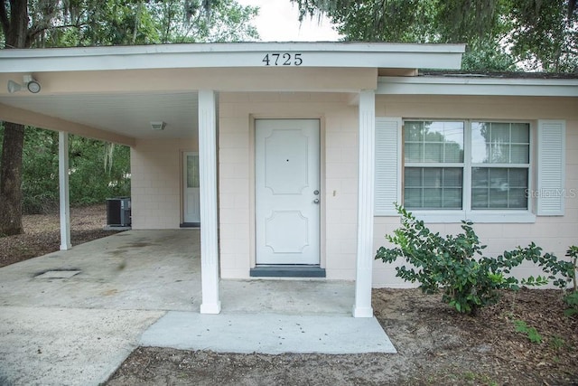 4725 Kayworth Rd, Lake Wales, FL 33898 - entrance to property featuring concrete block siding, central AC, and an attached carport