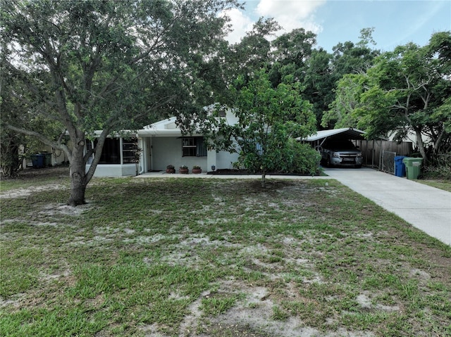 1422 Ave H SW, Winter Haven, FL 33880 - view of front facade featuring a detached carport, concrete driveway, and stucco siding