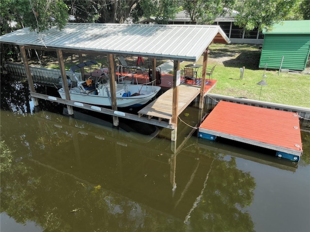 1422 Ave H SW, Winter Haven, FL 33880 - dock featuring boat lift, a water view, and a yard