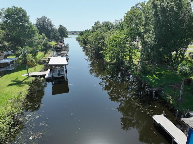 1422 Ave H SW, Winter Haven, FL 33880 - dock with a water view and a yard