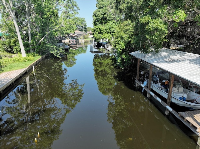 1422 Ave H SW, Winter Haven, FL 33880 - dock area featuring a water view and view of wooded area