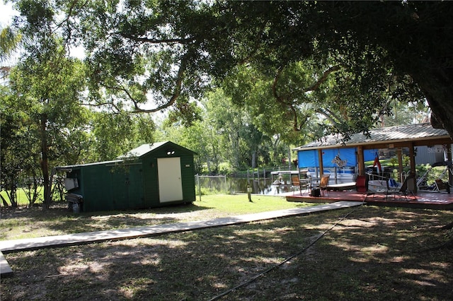 1422 Ave H SW, Winter Haven, FL 33880 - view of yard featuring a wooden deck and view of wooded area