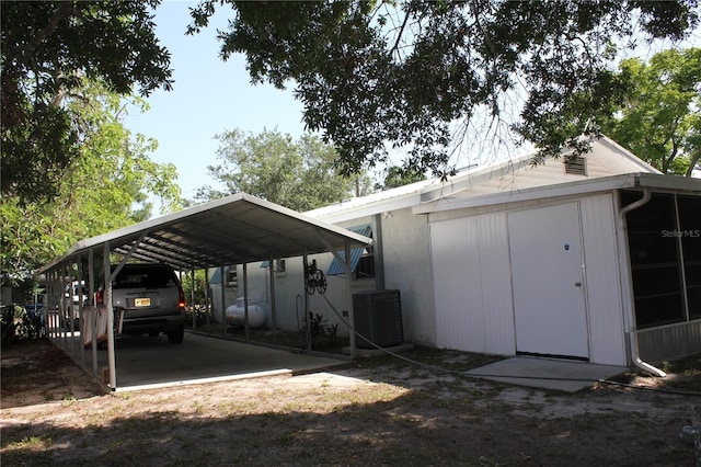 1422 Ave H SW, Winter Haven, FL 33880 - view of parking / parking lot featuring a detached carport