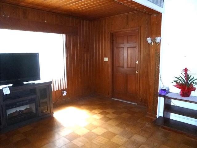 302 S Palm Ave, Frostproof, FL 33843 - entryway with wooden ceiling, wooden walls, and light floors